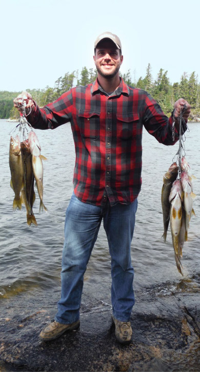 guy holding many fish